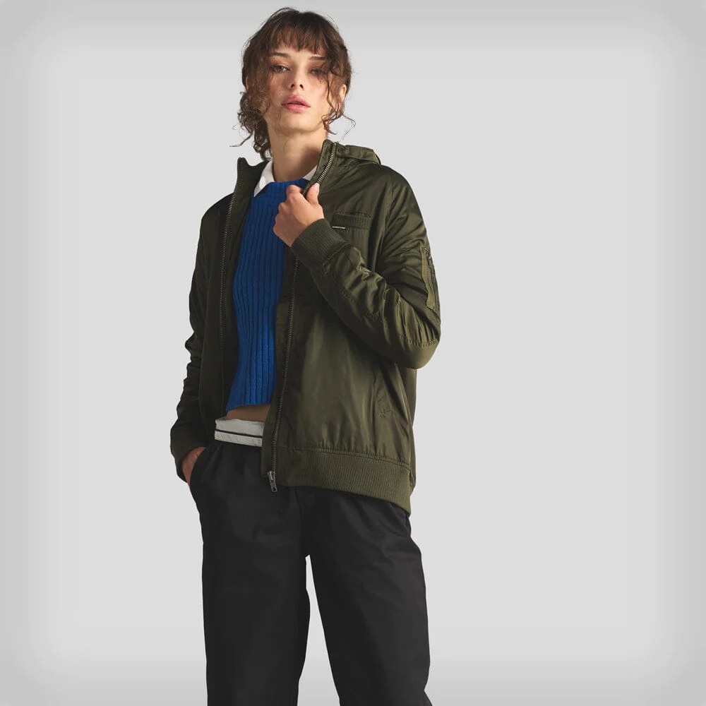 Model wearing a classic black Members Only custom jacket with iconic throat latch and shoulder epaulettes for corporate branding