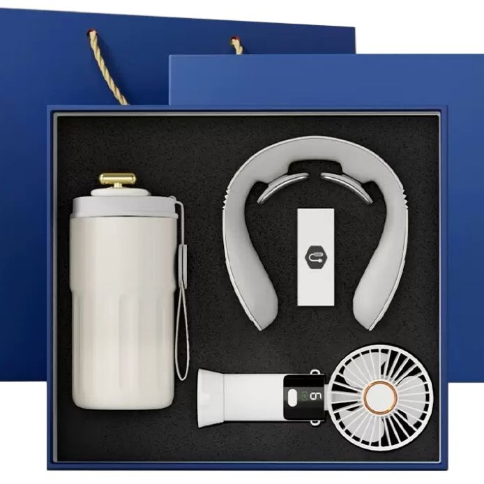Navy gift box open to reveal a smart temperature tumbler, portable neck massager, and USB fan with branded components on display.