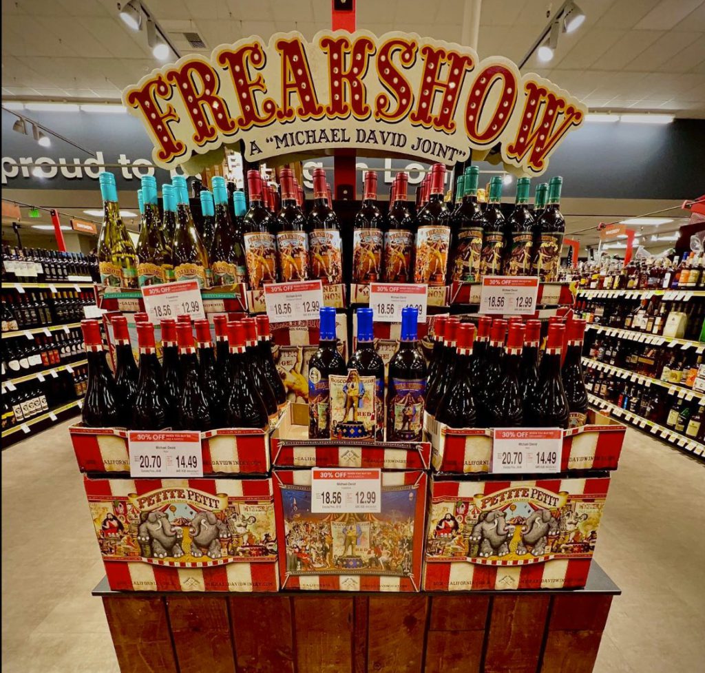 Illuminated FREAKSHOW poletopper and floor display in store