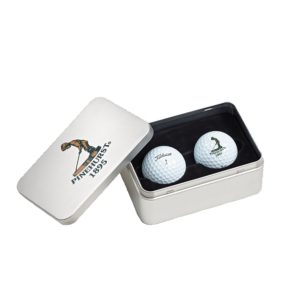 Silver Titleist golf ball tin with custom logo lid and two golf balls