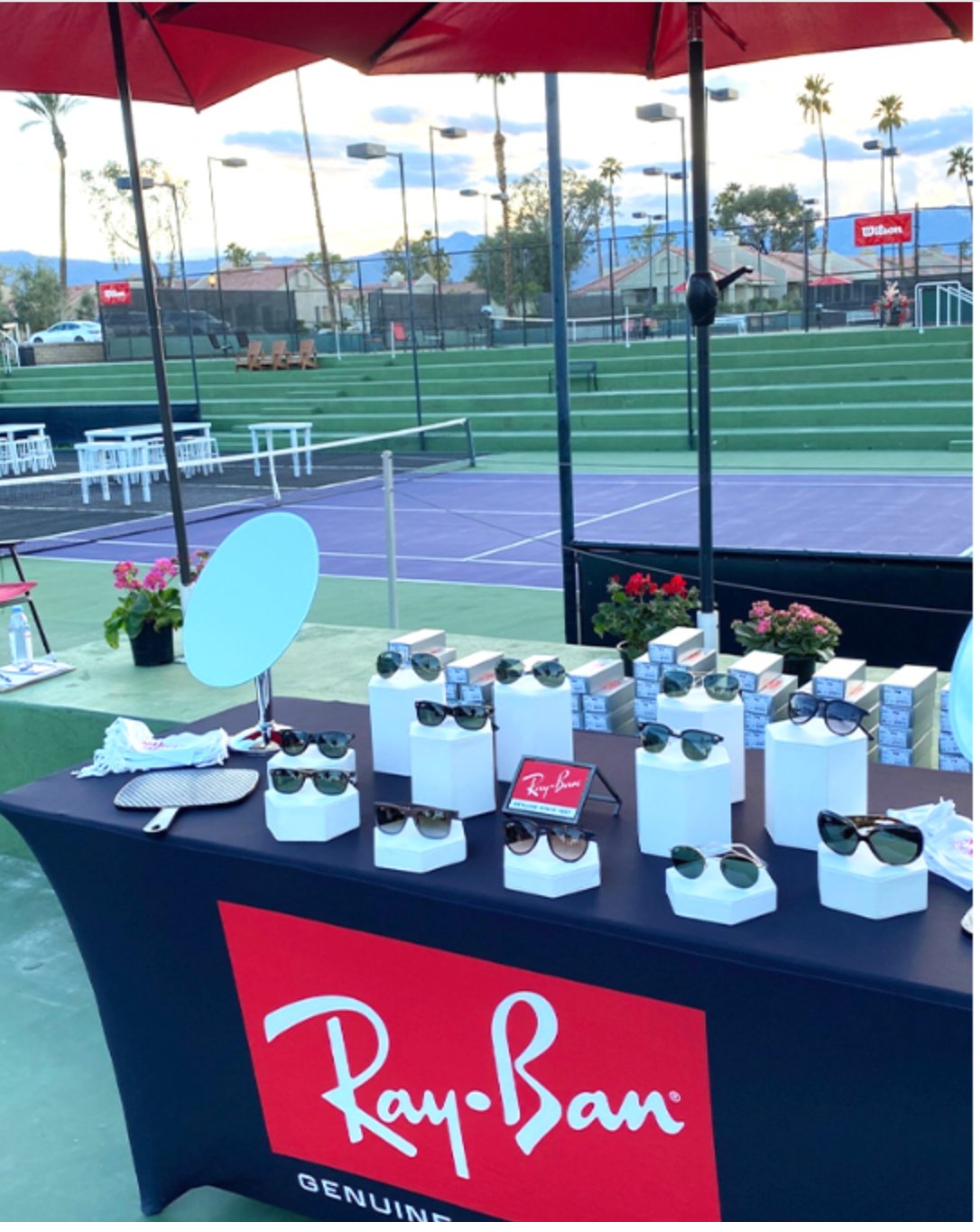 Branded Ray-Ban gifting station set up at an outdoor corporate event