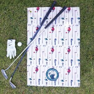 Custom golf towel in oversized waffle texture with golf clubs and glove