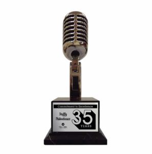 Vintage chrome-plated microphone trophy corporate award mounted on a solid base