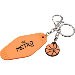 Orange basketball-shaped PVC keychain charm on a retro motel-style keytag