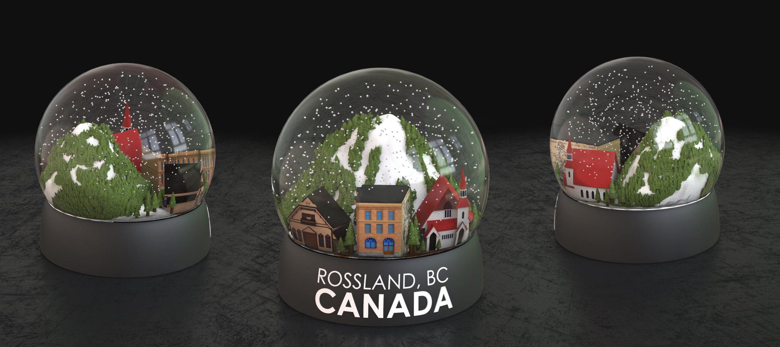 Three custom snow globes for Tourism Rossland with a ski hill and mountain town scene