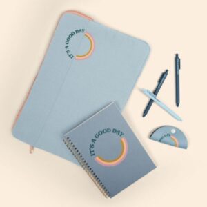 a new hire kit that features writing utensils and branded journals